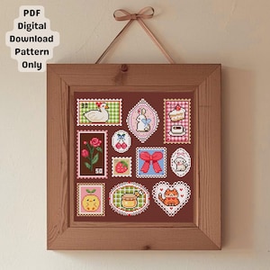 Puede incluir: Un patrón de punto de cruz enmarcado con varios diseños lindos que se asemejan a sellos postales. Los sellos incluyen un pato, un conejito, un pastel, una rosa, cerezas, un lazo, un perro, una fresa, un tarro de miel, un gato naranja y un limón. El marco es de madera, y el texto "PDF Digital Download Pattern Only" está en la esquina superior izquierda.