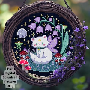 May include: A cross-stitch design depicting a white cat with fairy wings in a fantasy garden. The scene includes purple flowers, red mushrooms, a moon, and stars on a dark blue backdrop. The design is framed within a woven wreath, with text that reads 'PDF Digital Download Pattern Only'.