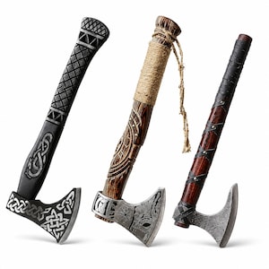 May include: Three axes with distinct designs. The left axe has a black handle with geometric carvings and a silver blade with knotwork. The center axe features a wood-grain handle with rope wrapping and a silver blade with etched symbols. The right axe has a dark wood handle with leather straps and a textured silver blade.