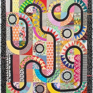 May include: A colorful quilt with a black and white design of a maze. The quilt is made up of many different fabrics with geometric patterns and bright colors.