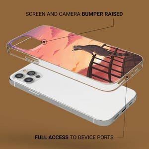 May include: Clear phone case with a sunset design and a raccoon illustration. The case has the text "SCREEN AND CAMERA BUMPER RAISED" and "FULL ACCESS TO DEVICE PORTS". The case is designed to protect the phone.