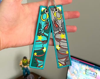 Porte-clés anime brodé jet tag recto-verso