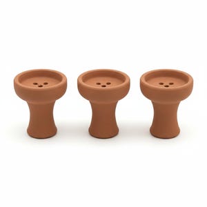 May include: Three terracotta hookah bowls are arranged on a white background. Each bowl has a round, shallow top with three small holes and a stem. The bowls are a warm, earthy brown color.
