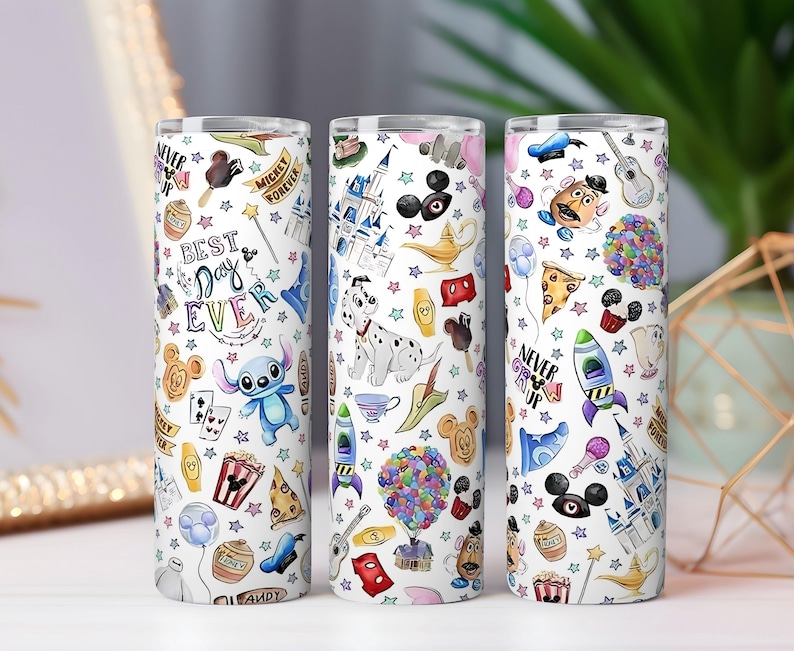 May include: Three white insulated tumblers with colorful Disney-themed illustrations. Each tumbler features various characters, icons, and phrases like "Best Day Ever" and "Never Grow Up". The designs include Stitch, Mickey Mouse, and a Dalmatian.