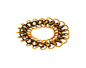 Stretchy Chainmail Bracelet With Black Neoprene And Orange Anodized Aluminum