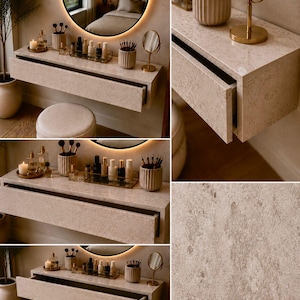 May include: A modern vanity with a neutral color palette. The floating vanity features a built-in drawer and is adorned with makeup, brushes, and a round mirror with a glowing light. A small stool sits below the vanity.
