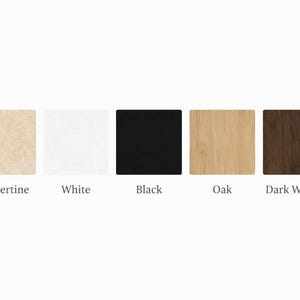 May include: A collection of five square samples showcasing different materials and colors. The samples include Travertine, White, Black, Oak, and Dark Walnut. Each sample has its name written below it in a clean, sans-serif font.