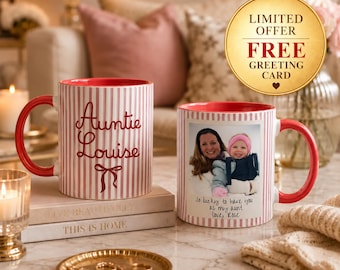 May include: Two ceramic mugs with a red and white vertical striped pattern. One mug features the red text 'Auntie Louise' above a bow graphic. The other mug displays a photograph of an adult and a child with the text 'So lucky to have you as my aunt love, Rose'.