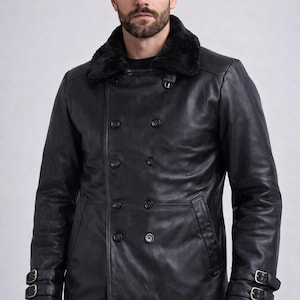 May include: Black leather coat with a faux fur collar. The double-breasted coat features two rows of buttons, two front pockets, and adjustable buckle straps on the sleeves. A classic outerwear piece.