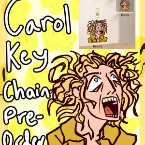 May include: A yellow background with a cartoon illustration of a person with wide eyes and an open mouth. The text "Carol Key Chain Pre-Order" is written in a playful font. A small keychain with the same illustration is shown.