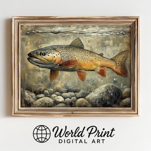Puede incluir: Una impresión enmarcada de una trucha marrón nadando bajo el agua. El pez tiene un patrón moteado y aletas rojas. La obra de arte está ambientada sobre un fondo de rocas y burbujas, con el texto "World Print DIGITAL ART" en la parte inferior.