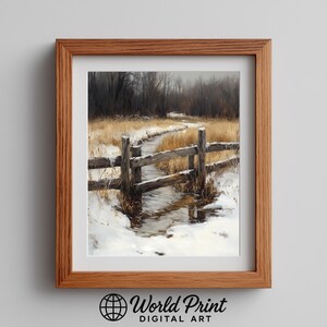 May include: A framed print of a winter scene. The artwork shows a stream with snow-covered banks and a wooden fence. The print is in a brown wooden frame. The artwork has the text "World Print DIGITAL ART" at the bottom.