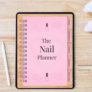 May include: A pink spiral-bound planner titled "The Nail Planner" with labeled tabs for clients, appointments, finances, inventory, and notes. The planner has a wooden-look border and includes a digital download for GoodNotes.