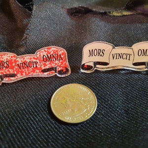 Death Conquers All in Latin pins
