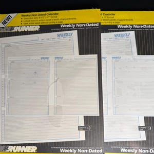 May include: Two Day-Runner brand weekly non-dated calendar refill packs in 8.5 by 11 inch format. The packaging is yellow and black with white text. Each pack displays a weekly planner layout with horizontal lines for appointments and time slots.