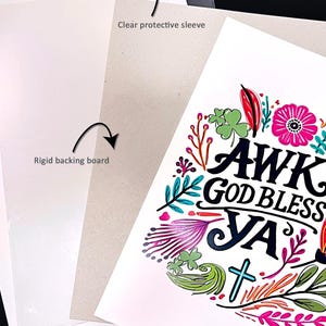 May include: A white paper print featuring the black text AWK GOD BLESS YA surrounded by colorful floral illustrations including pink, red, and green leaves and flowers. The print is shown with a clear protective sleeve, a rigid backing board, and a heavy cardboard envelope.