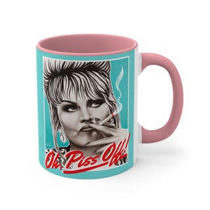 May include: White ceramic mug with a pink interior and handle. The mug features a portrait of a woman smoking a cigarette, set against a teal background. The text "Oh, Piss Off!" is printed in red.