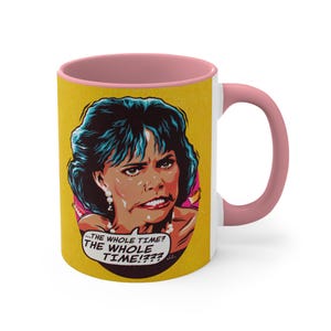 May include: A pink and white ceramic mug with a yellow background featuring a cartoon woman with blue hair and the text "...THE WHOLE TIME? THE WHOLE TIME!?!?"