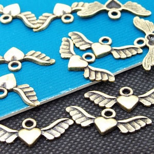 50pcs Superb Bronze Filigree Carved angel wings Findings Pendants 10mmx28mm A image 1