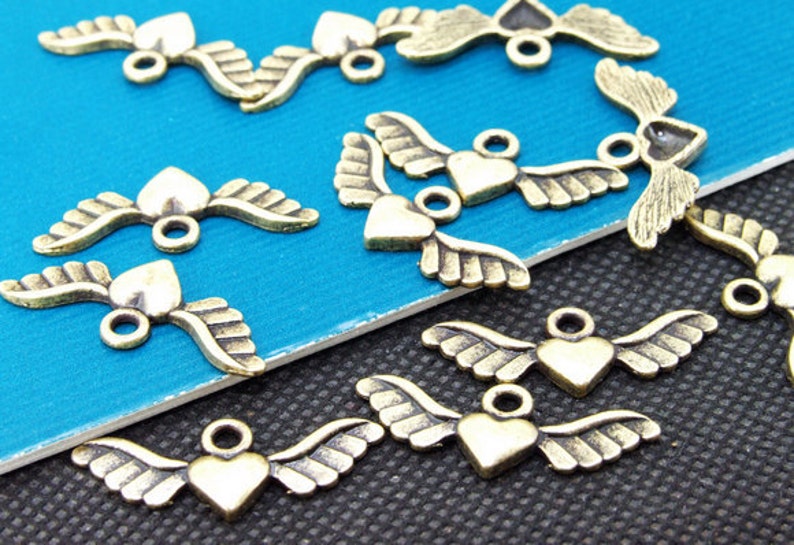 50pcs Superb Bronze Filigree Carved angel wings Findings Pendants 10mmx28mm A image 1