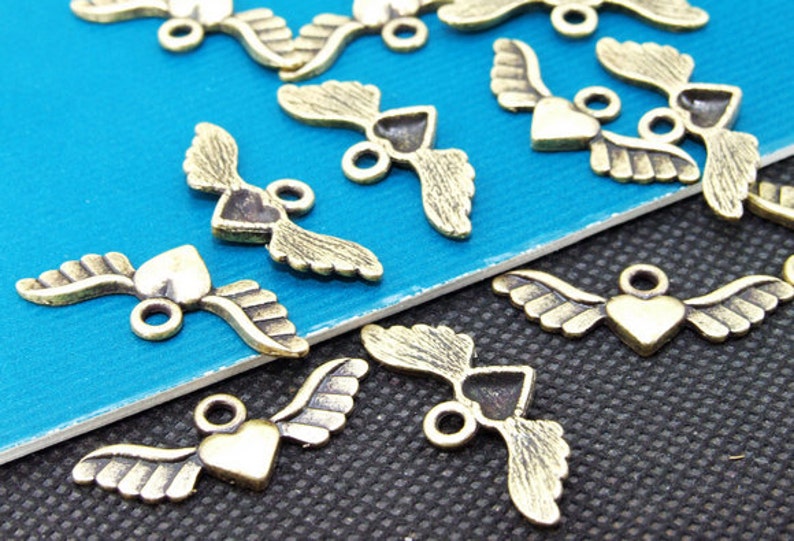 50pcs Superb Bronze Filigree Carved angel wings Findings Pendants 10mmx28mm A image 2