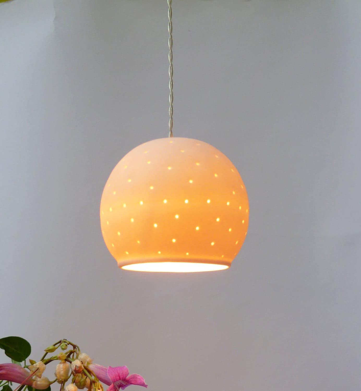 A perforated porcelain ball,