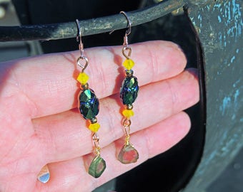 Earrings in gold filled 14 krats slices of Tourmalines and scarabs in Swarovski crystal.