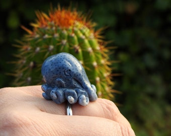 Adjustable 925 silver Octopus ring in fossilized blue coral stone