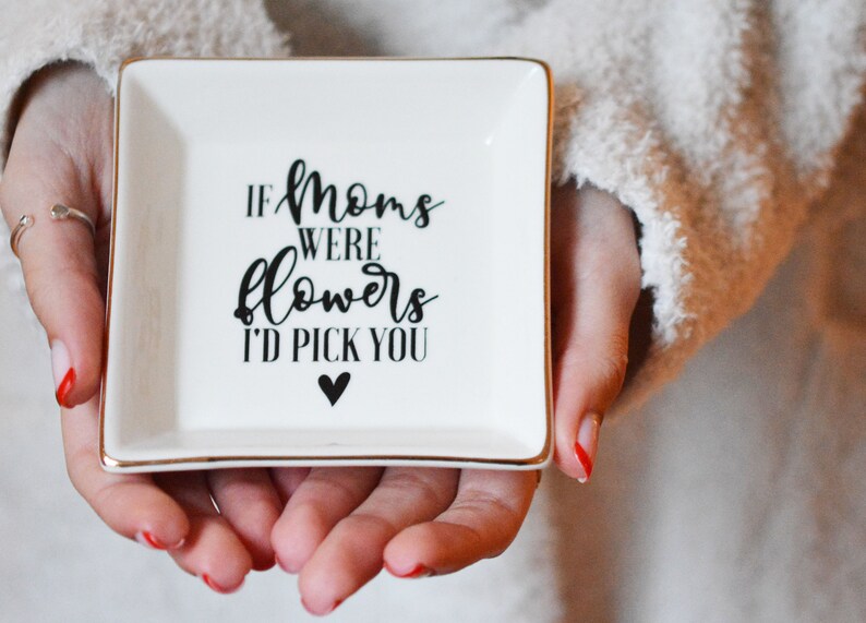 If your mom has a cute cosmetics bag already, you can try this delicate idea - a custom ring dish. It’s one of the best gifts for mom too. A cute jewelry dish with the text of “If mom were flowers, I’d pick you” will touch your mom’s heart. It can help her store earrings, rings, watches, and other small accessories. How it could be sweeter for mom when knowing her son cares about her tiny things like this?