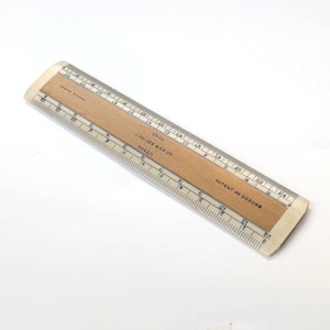 May include: A handmade, wooden cutting board with a natural finish. The board features a live edge on one side and a rectangular shape. It is approximately 18 inches long, 12 inches wide, and 1 inch thick.