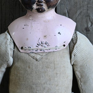 Primitive Antique Tin Minerva Doll with Cloth Body and Colorful Striped Socks image 3