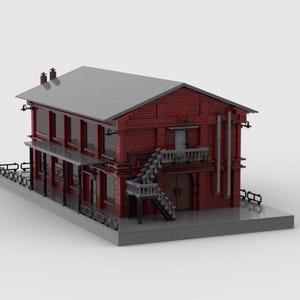 Puede incluir: Modelo detallado de un edificio de ladrillo de dos pisos con techo gris. El edificio presenta múltiples ventanas, un balcón y escaleras exteriores. El modelo está construido con pequeños ladrillos de plástico entrelazados, mostrando un diseño arquitectónico clásico.