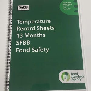 May include: A spiral-bound green notebook with the text "Temperature Record Sheets 13 Months SFBB Food Safety." The notebook has a clear plastic cover and the "Safe Catering" logo. The Food Standards Agency logo is also visible.