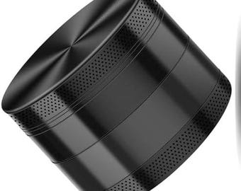 May include: A black cylindrical object with a textured, perforated top and bottom. The body has horizontal grooves and a shiny, metallic finish. The object appears to be made of metal.