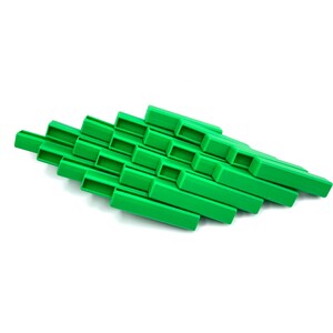 May include: A bright green, geometric, abstract sculpture. The object is composed of rectangular blocks arranged in a layered, diagonal pattern. The blocks have a hollow, open design. The sculpture is set against a white background.