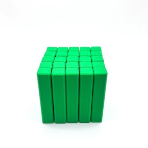 May include: A cube composed of numerous bright green rectangular blocks. The blocks are arranged in a grid pattern, creating a three-dimensional structure. The image is set against a plain white background.
