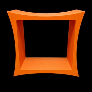 May include: A bright orange square-shaped display shelf featuring four concave sides that curve inward toward the center. The structure is hollow with a deep interior space, creating a bold geometric frame with smooth, solid surfaces throughout.