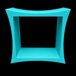 May include: A bright turquoise square shelf with concave sides. The frame features a smooth, solid finish with a hollow center, creating a geometric open-box structure. The design consists of four curved edges that flare outward at each corner.