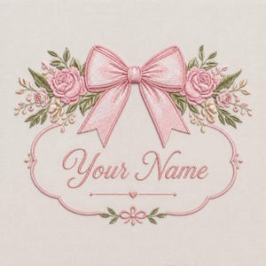 May include: Embroidered design featuring a pink bow, roses, and greenery. The design includes the text "Your Name" within a decorative frame. The color palette is soft, with pink and green accents on a cream background.