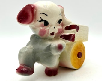 Maceta vintage MCM Shawnee Pottery de 5 pulgadas con forma de cachorro tirando de un carrito. Ideal para la habitación del bebé.