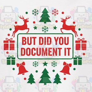 May include: White t-shirt with a festive Christmas design. The design includes red reindeer, green Christmas trees, snowflakes, and gift boxes. The text "BUT DID YOU DOCUMENT IT" is in a green rectangle.