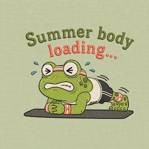 May include: An embroidered design features a green frog in a push-up position on a black mat. The frog wears a white tank top, black shorts, and a red headband and wristbands. The text "Summer body loading..." is above the frog.