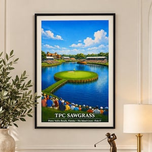 May include: A framed vertical wall art print depicting the TPC Sawgrass island green golf hole. The image features a vibrant blue water hazard surrounding a green island, spectators, and the text TPC SAWGRASS Ponte Vedra Beach, Florida.