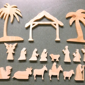 May include: A white ceramic mug with a black handle and the text "But First, Coffee" in a bold, black font. The mug is set against a neutral background, highlighting its simple design.