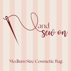 May include: A medium-sized cosmetic bag with a striped background in shades of pink and white. The bag's logo features a needle and thread with the words "Land and Sew on".