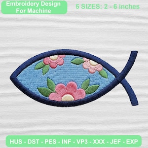 May include: An embroidery design for machine featuring a fish shape with a dark blue border. The interior is light blue with three pink flowers and green leaves. Text reads: Embroidery Design For Machine, 5 SIZES: 2 - 6 inches, HUS - DST - PES - INF - VP3 - XXX - JEF - EXP.