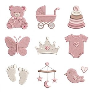 May include: A collection of nine embroidered baby-themed icons in shades of pink and cream. The set includes a teddy bear, a baby carriage, a stacking ring toy, a butterfly, a crown, a onesie, baby footprints, a hanging mobile, and a bird with a heart.