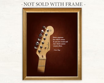 Peut inclure: Une impression encadrée avec une citation sur la musique de Victor Hugo. La citation dit : "La musique exprime ce qui ne peut pas être mis en mots et ce qui ne peut pas rester silencieux." L'impression présente un gros plan de la tête d'une guitare électrique Fender.