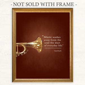 May include: A gold trumpet with a quote about music washing away the dust of everyday life. The quote is attributed to Auerbach. The image is framed with a gold frame and has a dark red background.