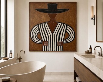 May include: A square wall art piece featuring a stylized figure wearing a wide-brimmed black hat and a long-sleeved shirt with vertical black and white stripes. The figure is set against a solid brown background with a dark brown frame.